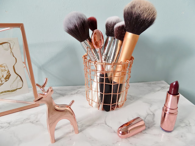 Copper make up brush holder with marble background